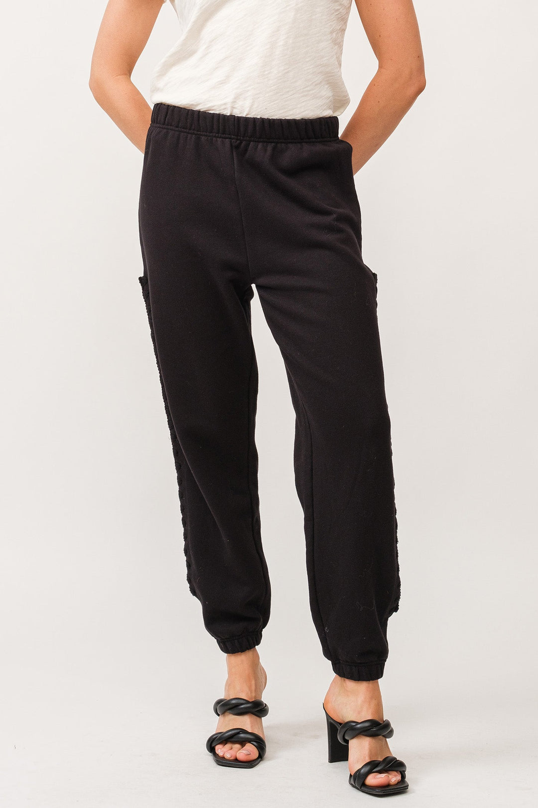 image of a female model wearing a KIMBERLY HANDMADE MACRAME DETAIL JOGGER PANTS BLACK DEAR JOHN DENIM 