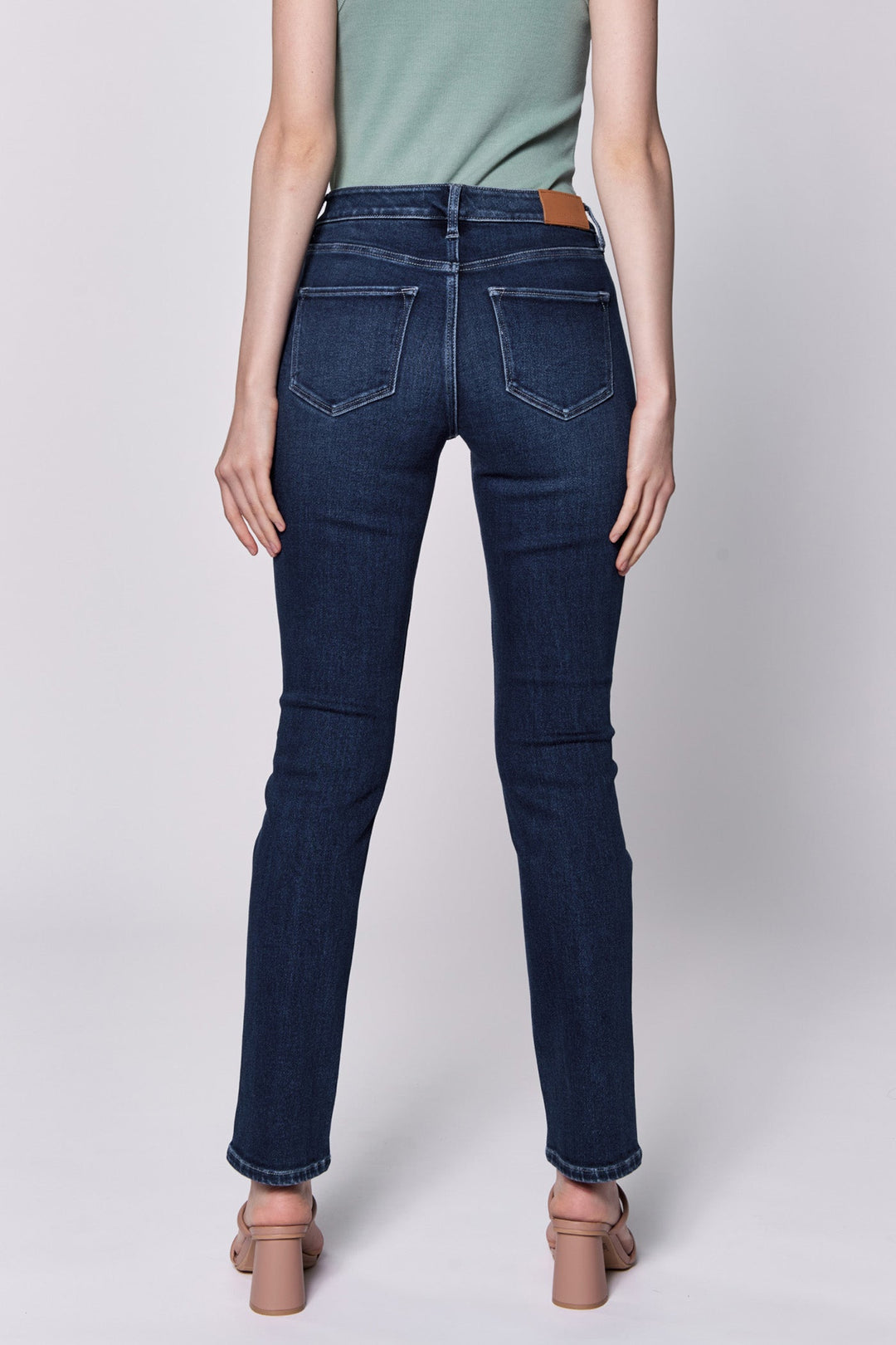 image of a female model wearing a BLAIRE MID RISE SLIM STRAIGHT LEG JEANS RIVIERA DEAR JOHN DENIM 