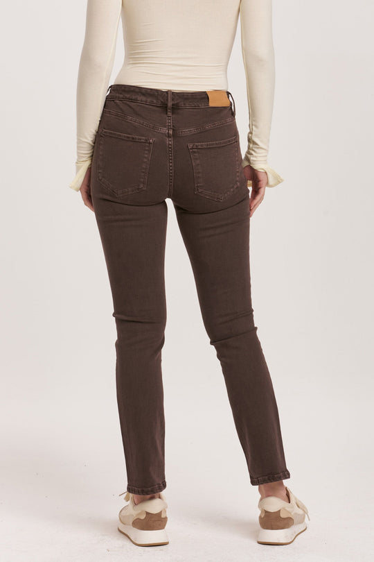 image of a female model wearing a BLAIRE MID RISE SLIM STRAIGHT JEANS MOCHA BROWN DEAR JOHN DENIM 