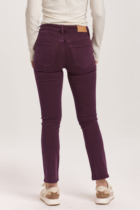 image of a female model wearing a BLAIRE MID RISE SLIM STRAIGHT JEANS MURSAKI PURPLE DEAR JOHN DENIM 