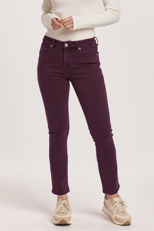 image of a female model wearing a BLAIRE MID RISE SLIM STRAIGHT JEANS MURSAKI PURPLE DEAR JOHN DENIM 