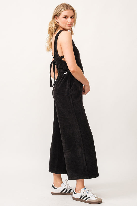 image of a female model wearing a SIVAN TANK JUMPSUIT BLACK CHENILLE DEAR JOHN DENIM 