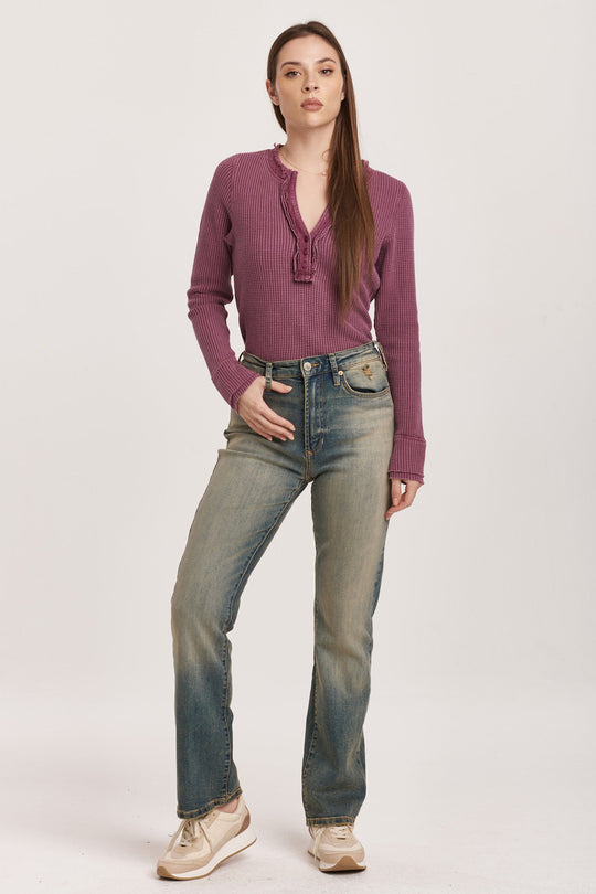 image of a female model wearing a PARIS BOOTCUT FIT SUPER HIGH RISE JEAN WRATH DEAR JOHN DENIM 