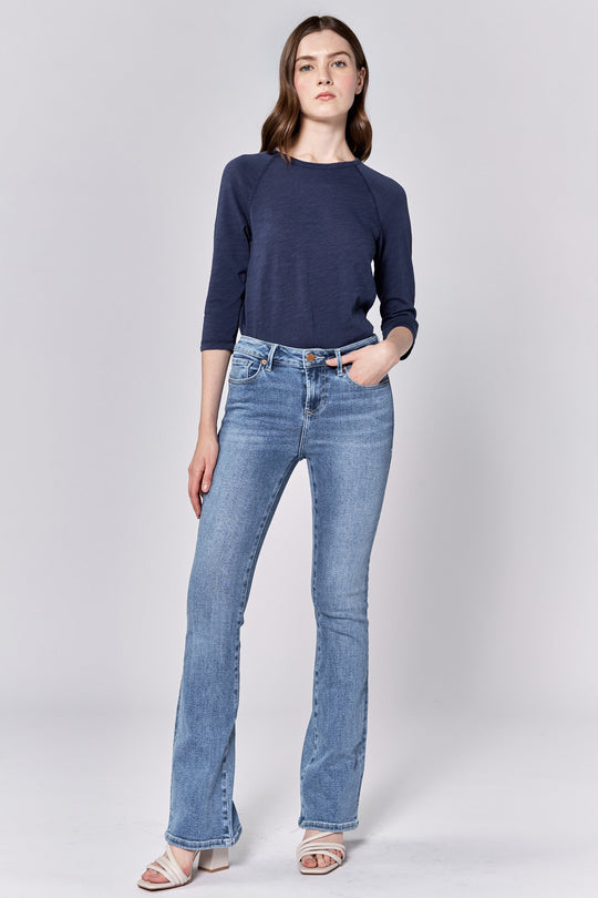 image of a female model wearing a JAXTYN MID RISE FULL INSEAM BOOTCUT JEANS LOVELLE DEAR JOHN DENIM 