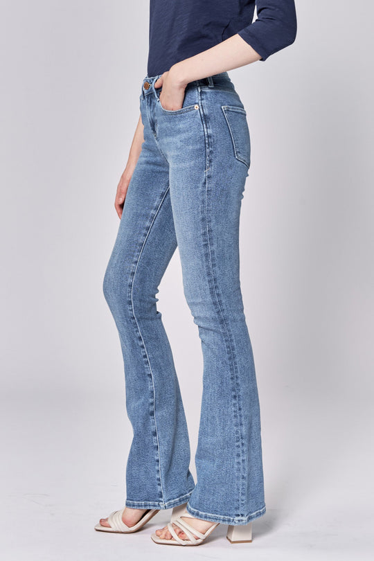 image of a female model wearing a JAXTYN MID RISE FULL INSEAM BOOTCUT JEANS LOVELLE DEAR JOHN DENIM 