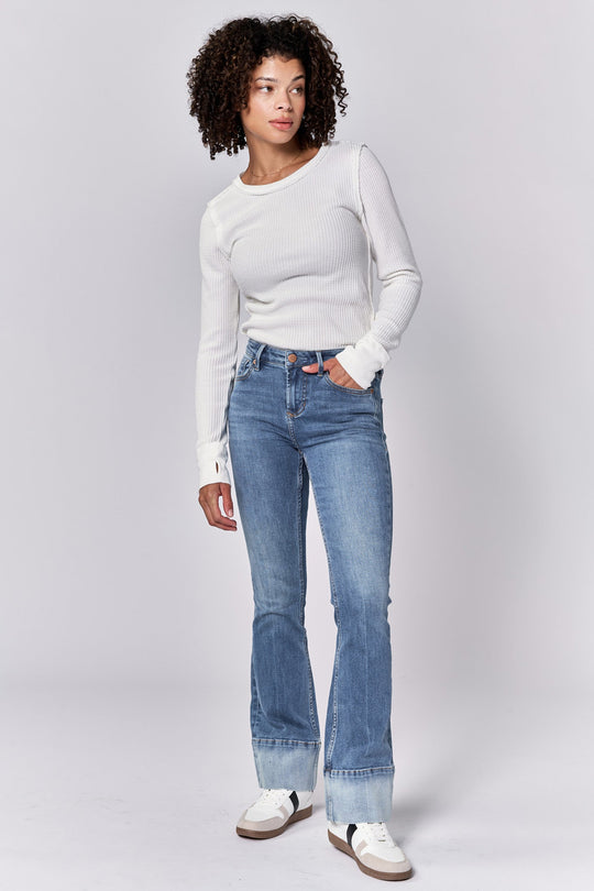 image of a female model wearing a JAXTYN MID RISE FULL INSEAM BOOTCUT JEANS LAGOON DEAR JOHN DENIM 