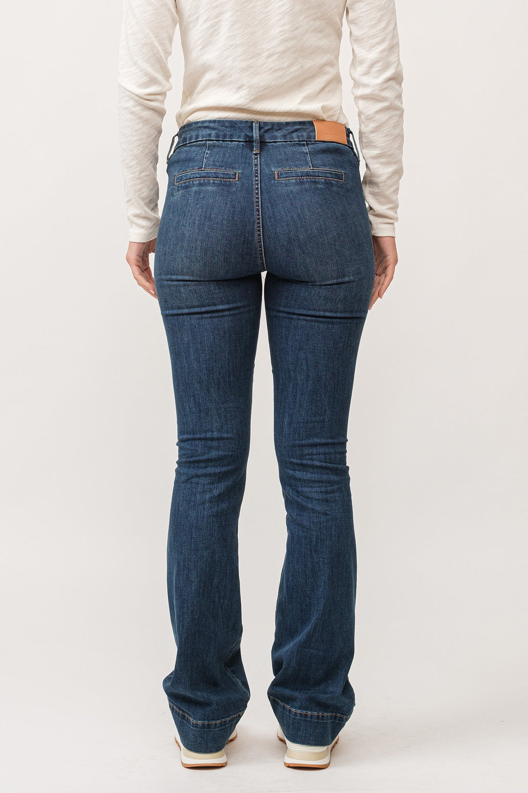 image of a female model wearing a JAXTYN MID RISE CLEAN WIDE HEM BOOTCUT JEANS DAZZLER DEAR JOHN DENIM 