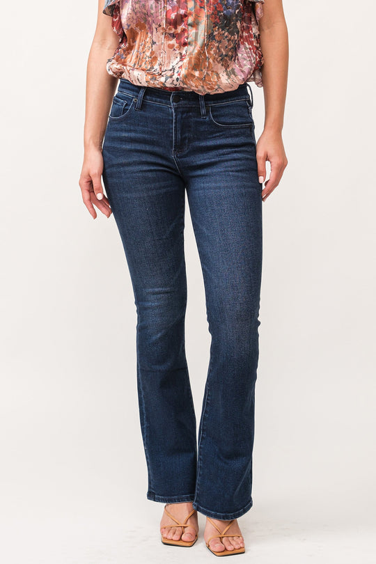 image of a female model wearing a JAXTYN MID RISE CLEAN HEM BOOTCUT JEANS BOSTON DEAR JOHN DENIM 