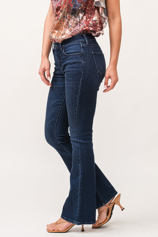 image of a female model wearing a JAXTYN MID RISE CLEAN HEM BOOTCUT JEANS BOSTON DEAR JOHN DENIM 