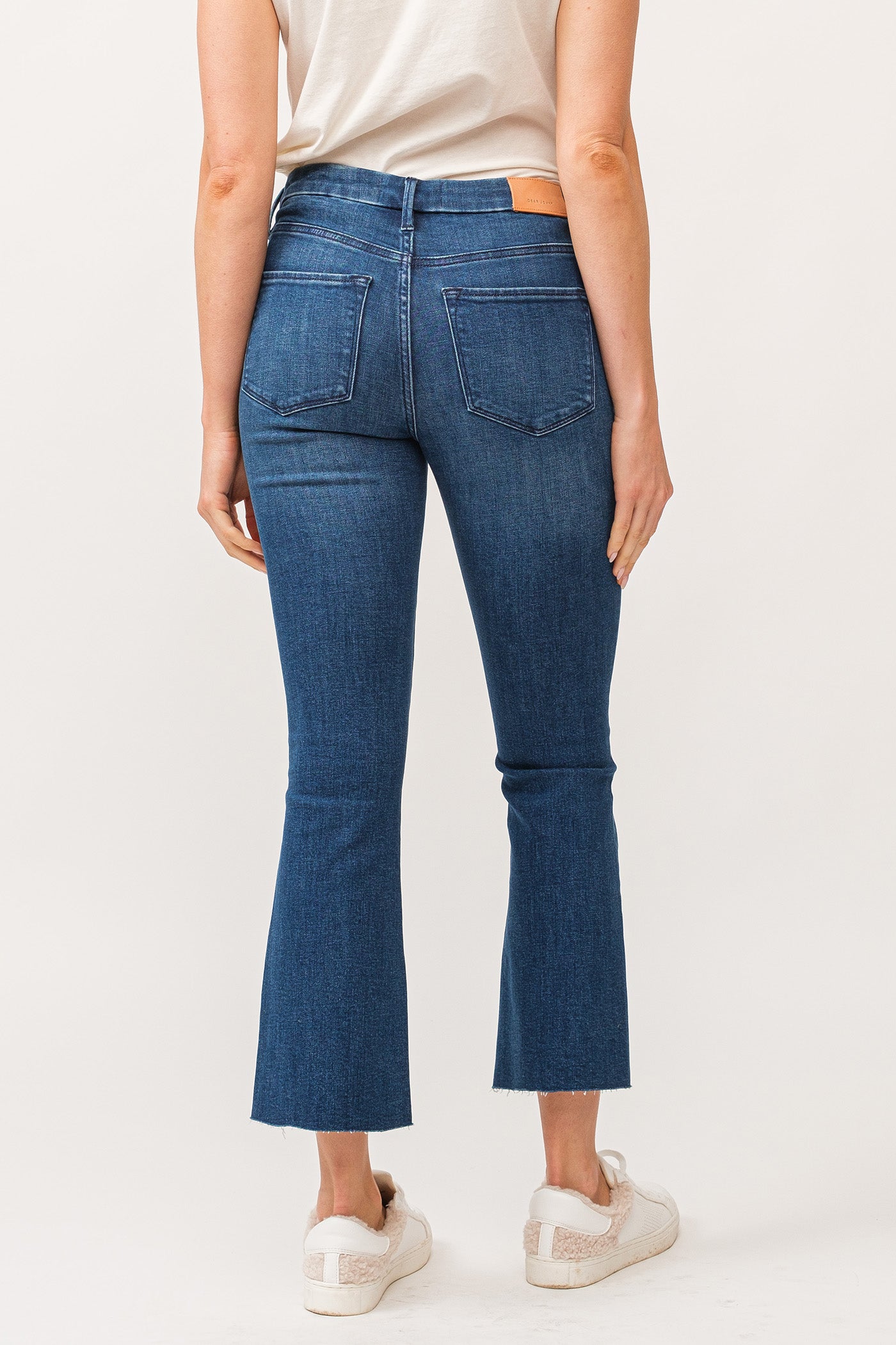 image of a female model wearing a JEANNE MID RISE RAW CUT HEM FLARE JEANS VIOLET BLUE DEAR JOHN DENIM 