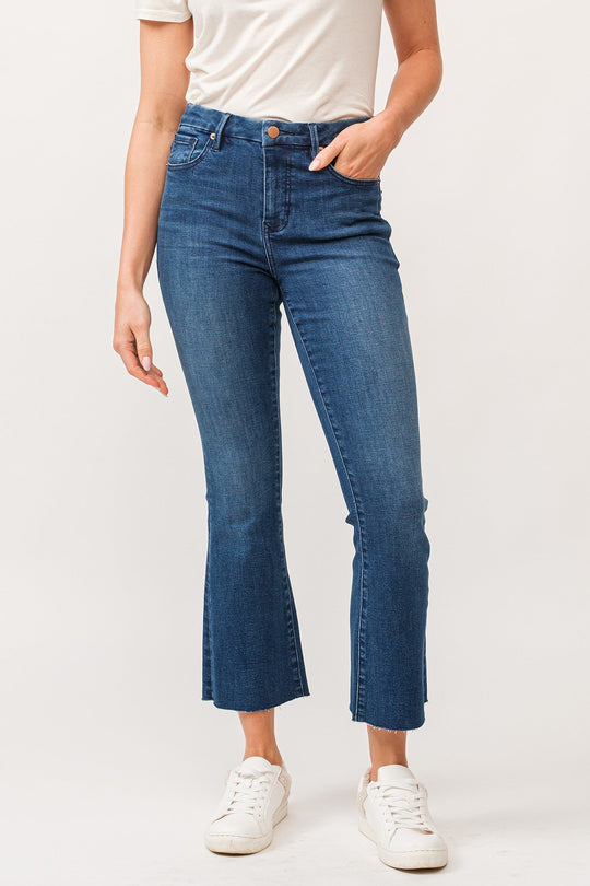 image of a female model wearing a JEANNE MID RISE RAW CUT HEM FLARE JEANS VIOLET BLUE DEAR JOHN DENIM 