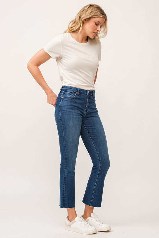 image of a female model wearing a JEANNE MID RISE RAW CUT HEM FLARE JEANS VIOLET BLUE DEAR JOHN DENIM 