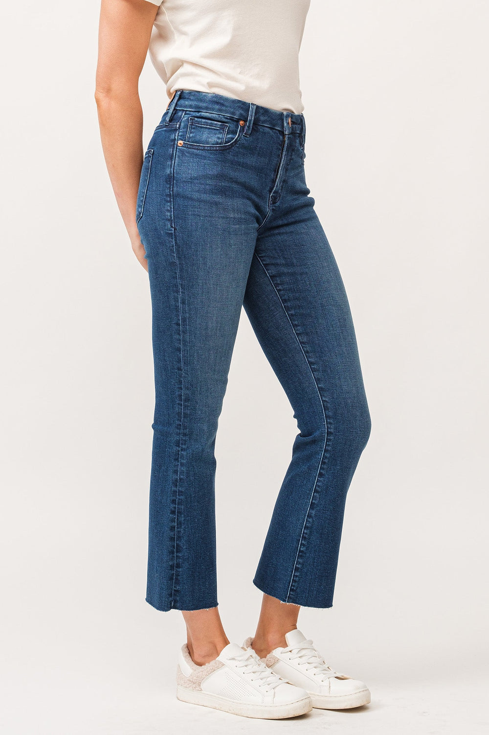 image of a female model wearing a JEANNE MID RISE RAW CUT HEM FLARE JEANS VIOLET BLUE DEAR JOHN DENIM 