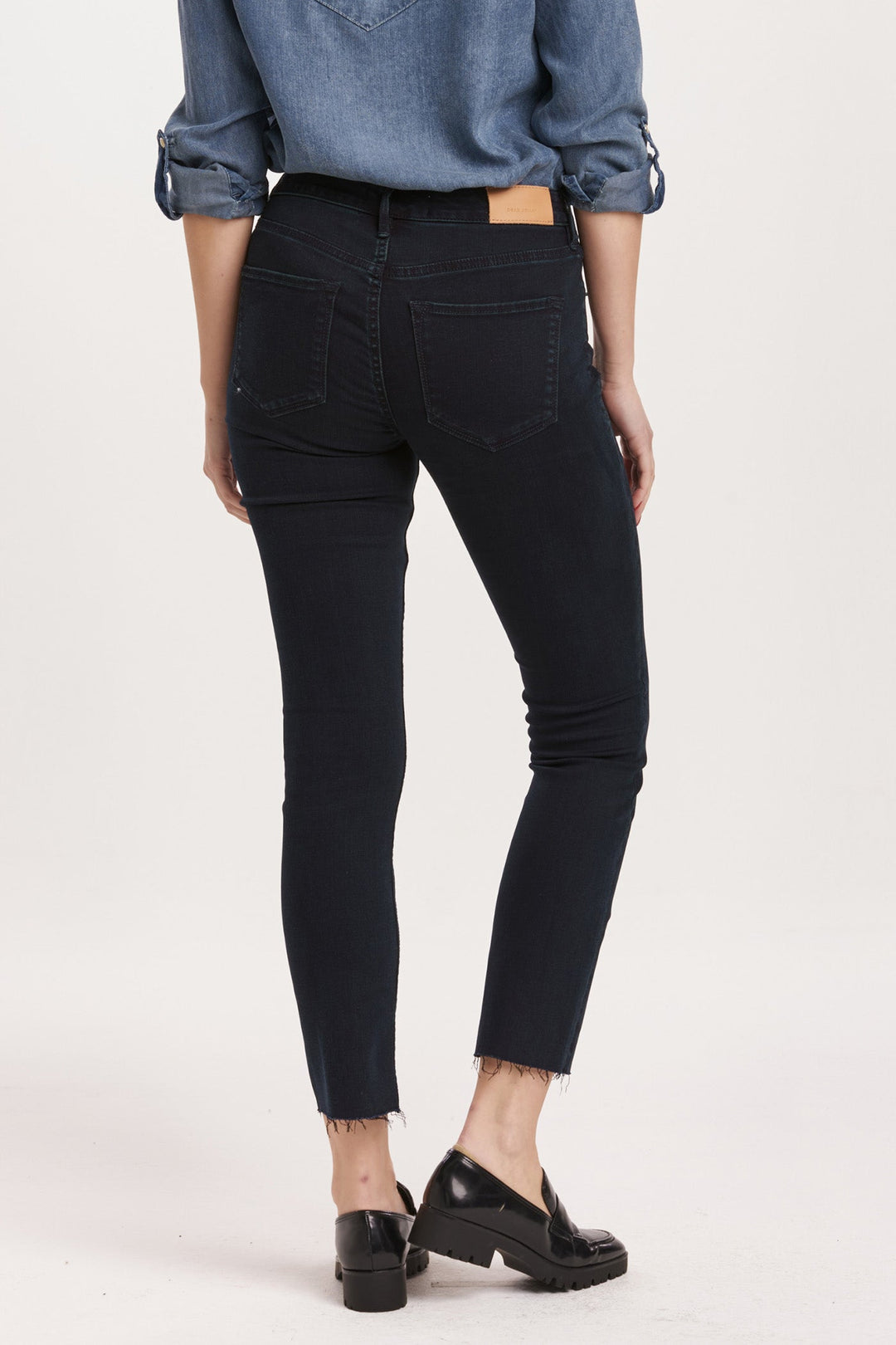 image of a female model wearing a BLAIRE MID RISE SLIM STRAIGHT JEANS YORKVILLE DEAR JOHN DENIM 