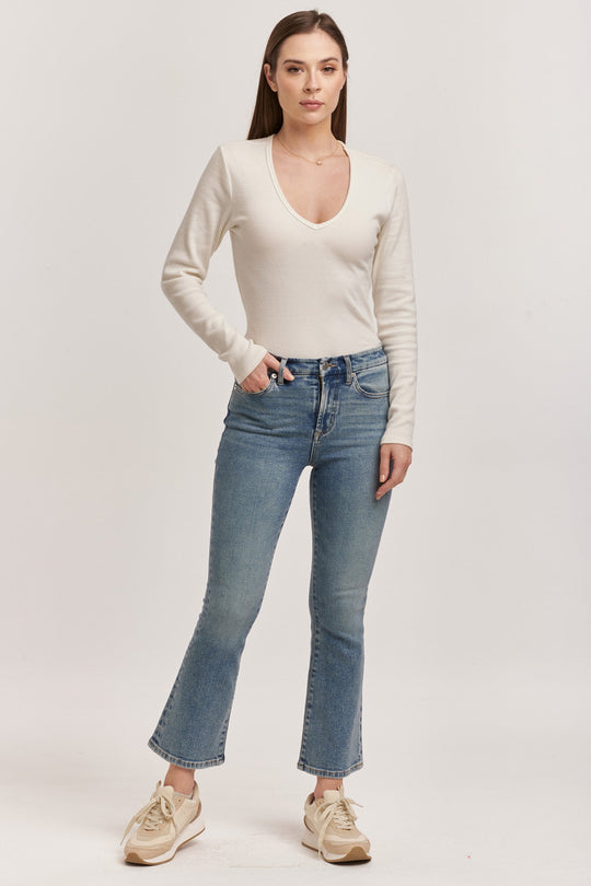 image of a female model wearing a JEANNE HIGH RISE CROPPED FLARE JEANS ANTIQUE WASH DEAR JOHN DENIM 