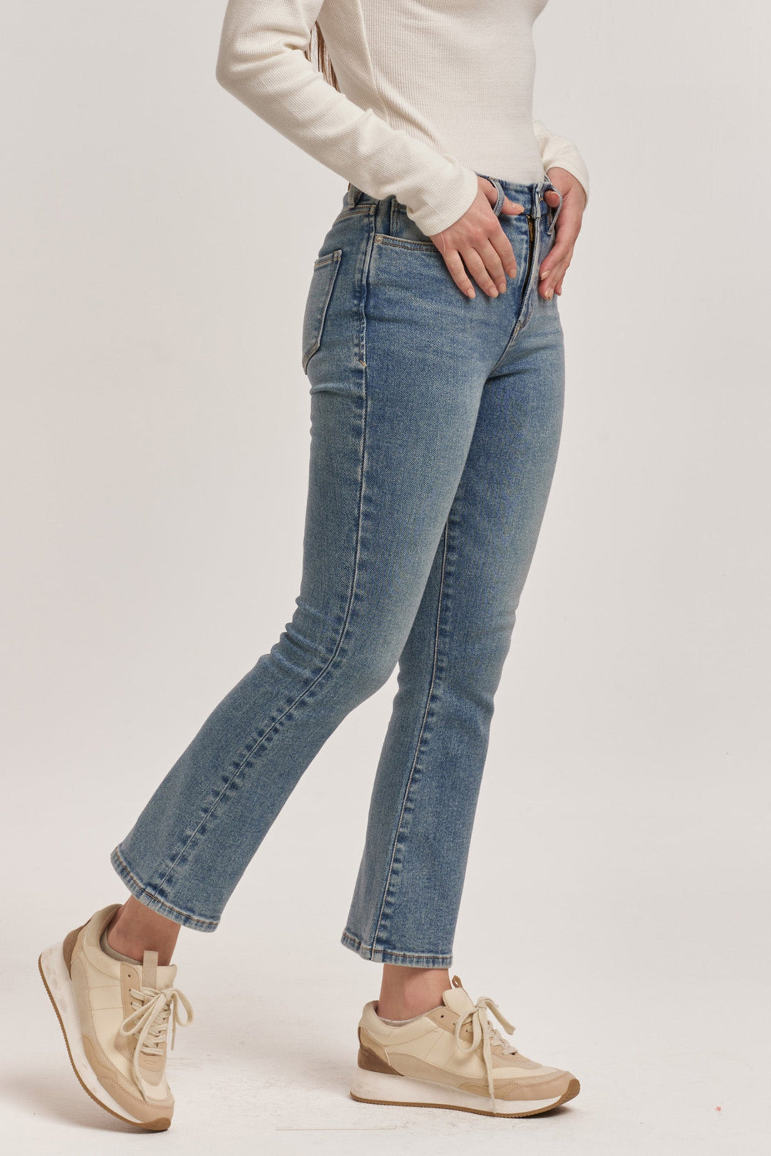 image of a female model wearing a JEANNE HIGH RISE CROPPED FLARE JEANS ANTIQUE WASH DEAR JOHN DENIM 