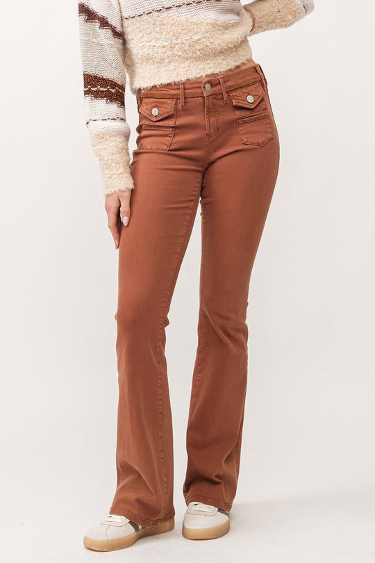 image of a female model wearing a JAXTYN MID RISE CLEAN HEM BOOTCUT JEANS BURNT SIENNA DEAR JOHN DENIM 