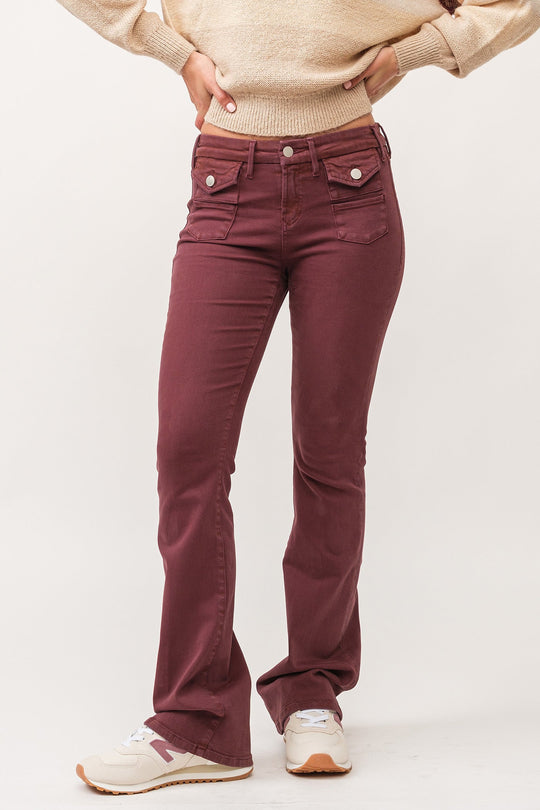 image of a female model wearing a JAXTYN MID RISE CLEAN HEM BOOTCUT JEANS MAROON DEAR JOHN DENIM 