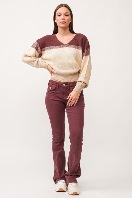 image of a female model wearing a JAXTYN MID RISE CLEAN HEM BOOTCUT JEANS MAROON DEAR JOHN DENIM 