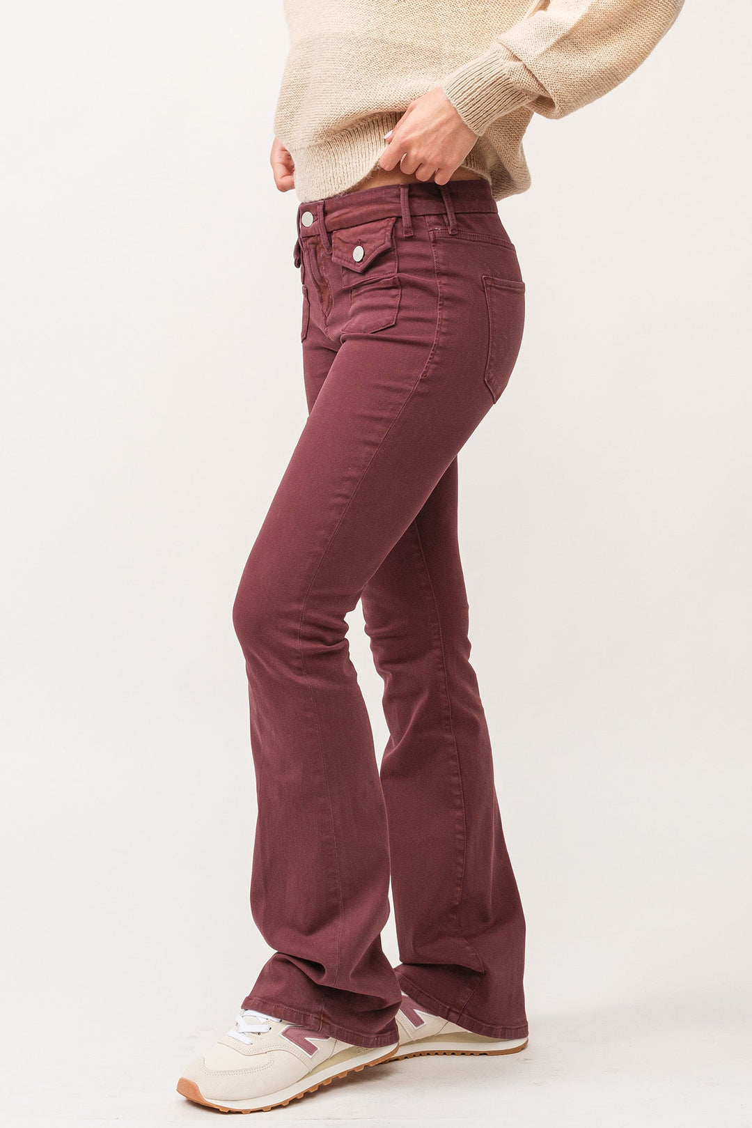 image of a female model wearing a JAXTYN MID RISE CLEAN HEM BOOTCUT JEANS MAROON DEAR JOHN DENIM 