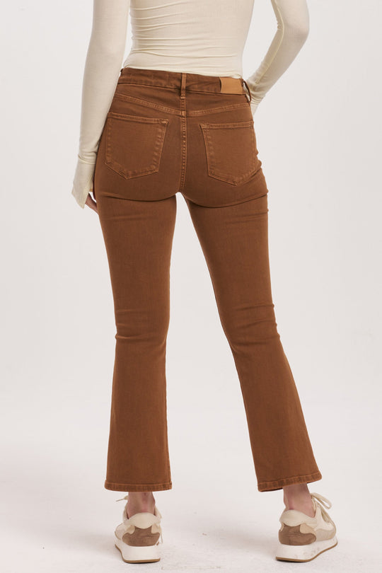 image of a female model wearing a JEANNE HIGH RISE CROPPED FLARE JEANS BURNT SIENNA DEAR JOHN DENIM 