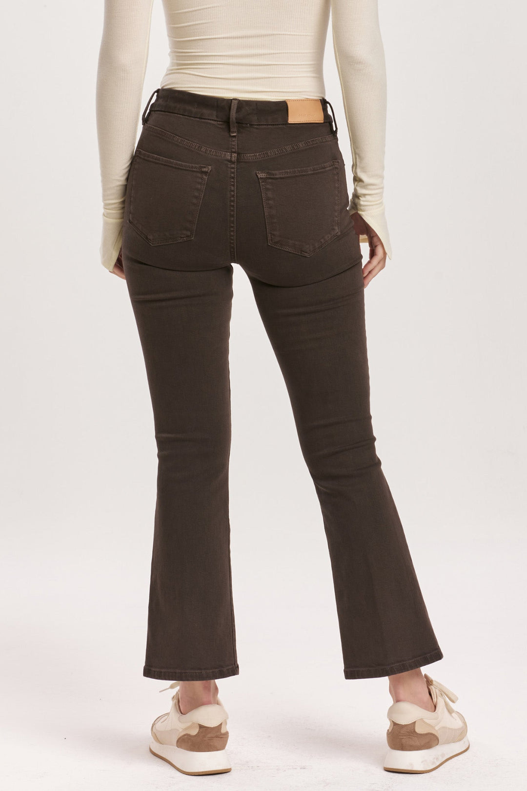 image of a female model wearing a JEANNE HIGH RISE CROPPED FLARE JEANS GROUND COFFEE DEAR JOHN DENIM 