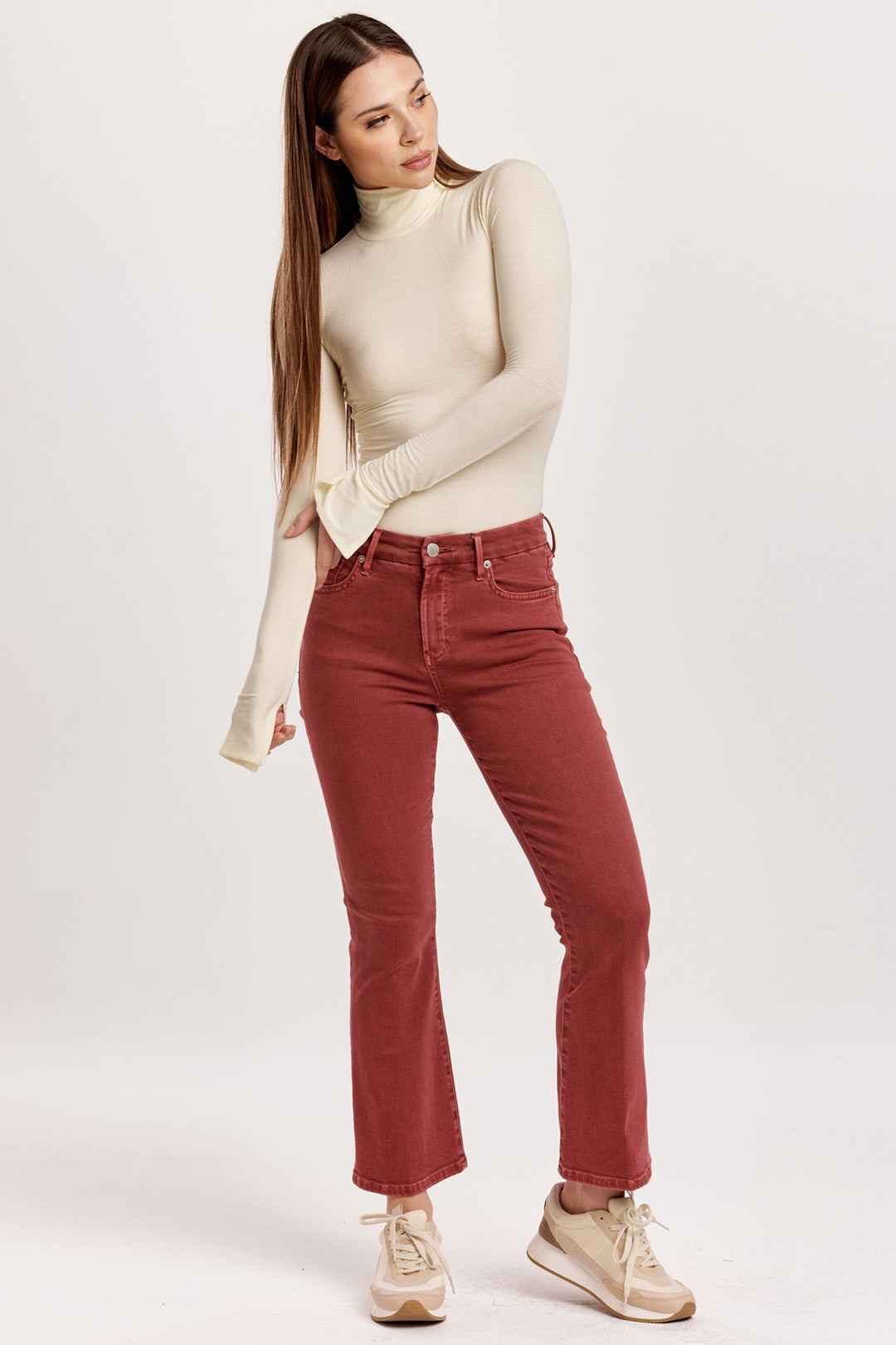 image of a female model wearing a JEANNE HIGH RISE CROPPED FLARE JEANS INTENSE RUST DEAR JOHN DENIM 