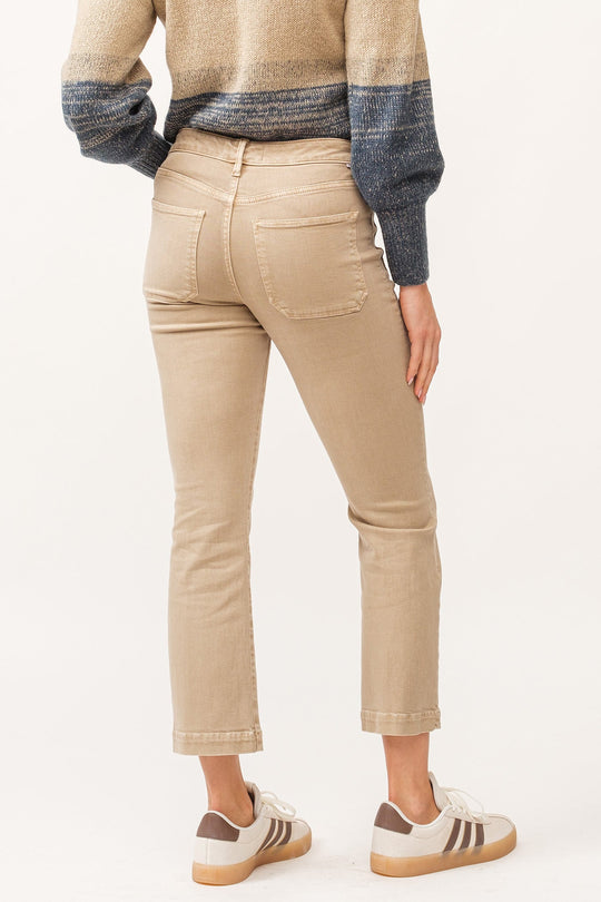 image of a female model wearing a JEANNE MID RISE CLEAN HEM FLARE JEANS NOMAD DEAR JOHN DENIM 