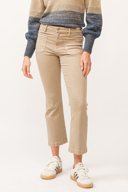 image of a female model wearing a JEANNE MID RISE CLEAN HEM FLARE JEANS NOMAD DEAR JOHN DENIM 