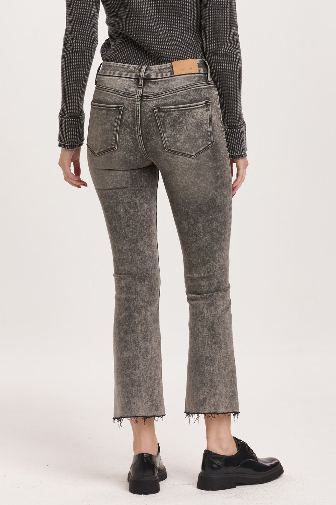 image of a female model wearing a JEANNE HIGH RISE CROPPED FLARE JEANS SHADE DEAR JOHN DENIM 