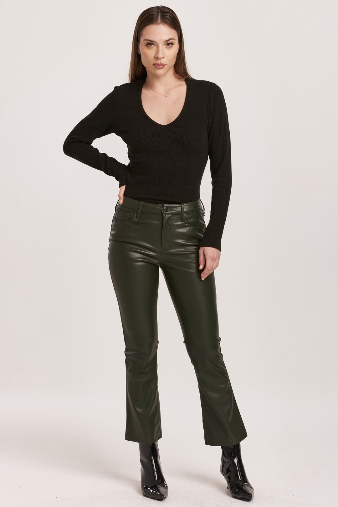 image of a female model wearing a JEANNE SUPER HIGH RISE CROPPED FLARE PANTS HUNTER GREEN VEGAN LEATHER DEAR JOHN DENIM 