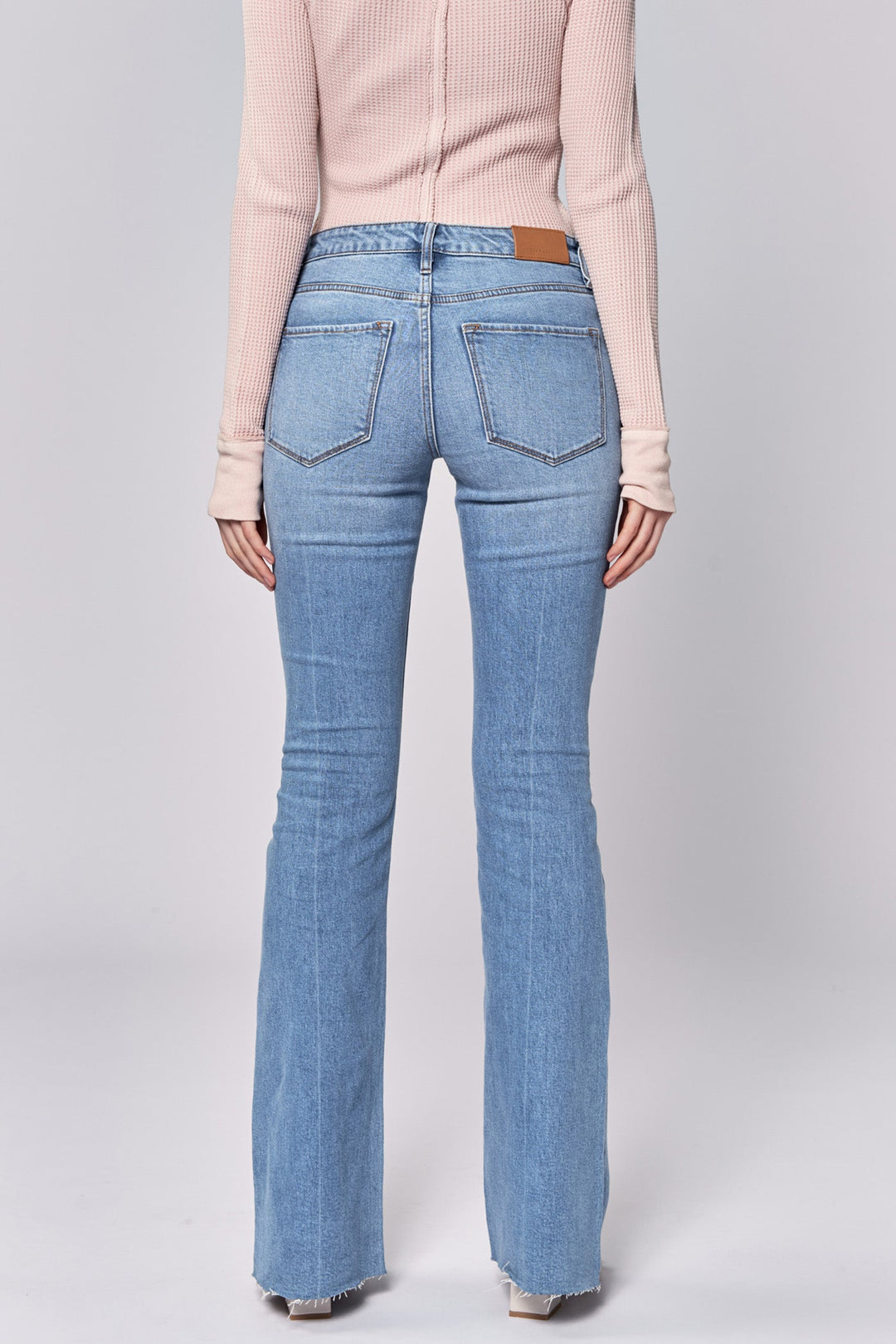 image of a female model wearing a ROSA MID RISE FULL INSEAM FLARE JEANS BELLE DEAR JOHN DENIM 