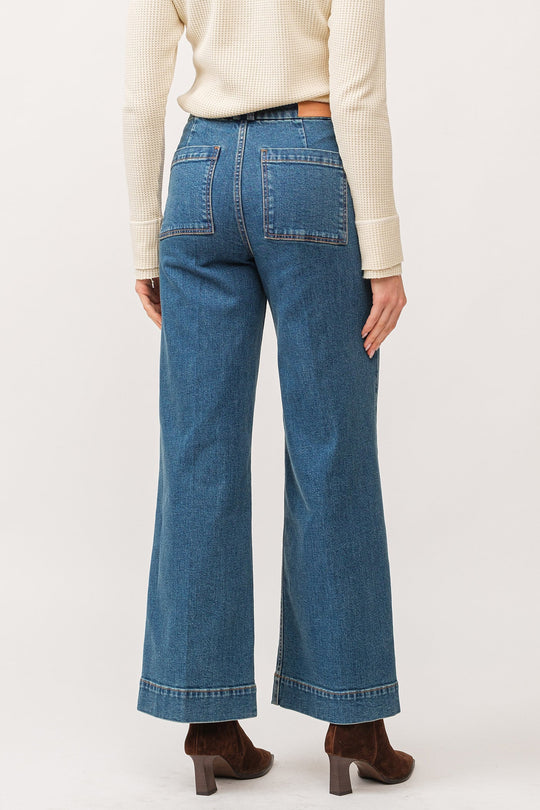 image of a female model wearing a AUDREY HIGH RISE CLEAN HEM WIDE LEG JEANS BLUENOTE DEAR JOHN DENIM 