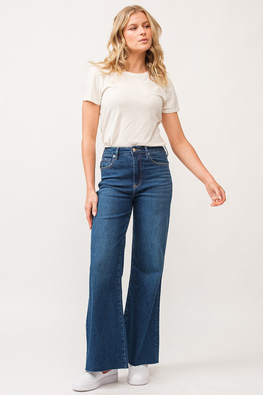 image of a female model wearing a FIONA HIGH RISE RAW CUT HEM WIDE LEG JEANS BOREALIS DEAR JOHN DENIM 