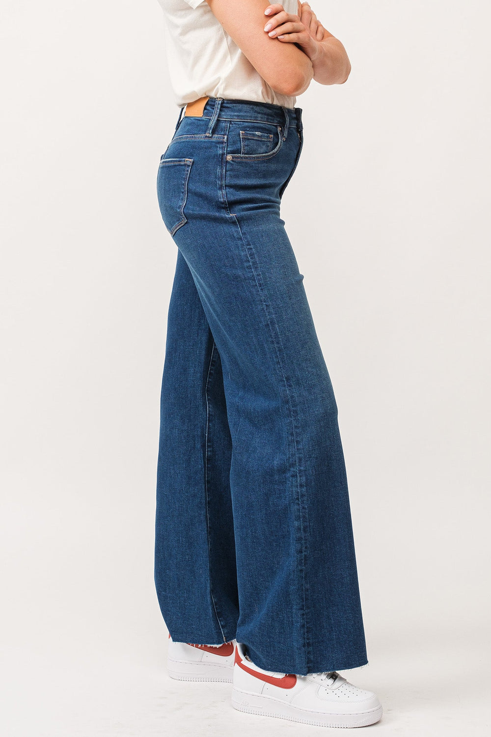 image of a female model wearing a FIONA HIGH RISE RAW CUT HEM WIDE LEG JEANS BOREALIS DEAR JOHN DENIM 