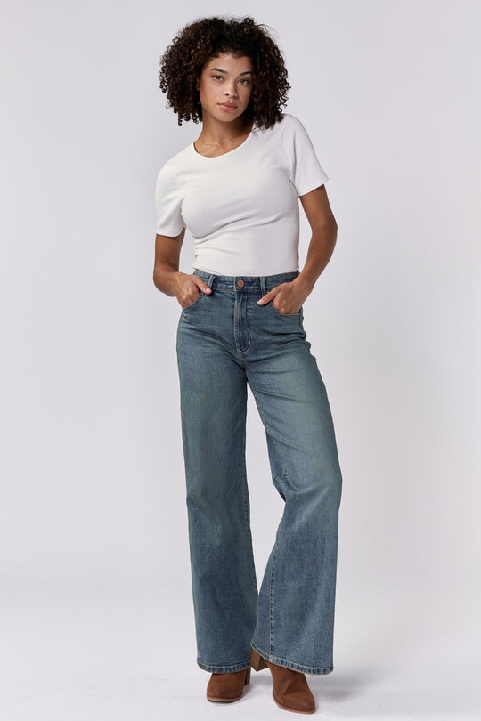 image of a female model wearing a FIONA HIGH RISE FULL INSEAM CLEAN HEM JEANS ASH MIST DEAR JOHN DENIM 