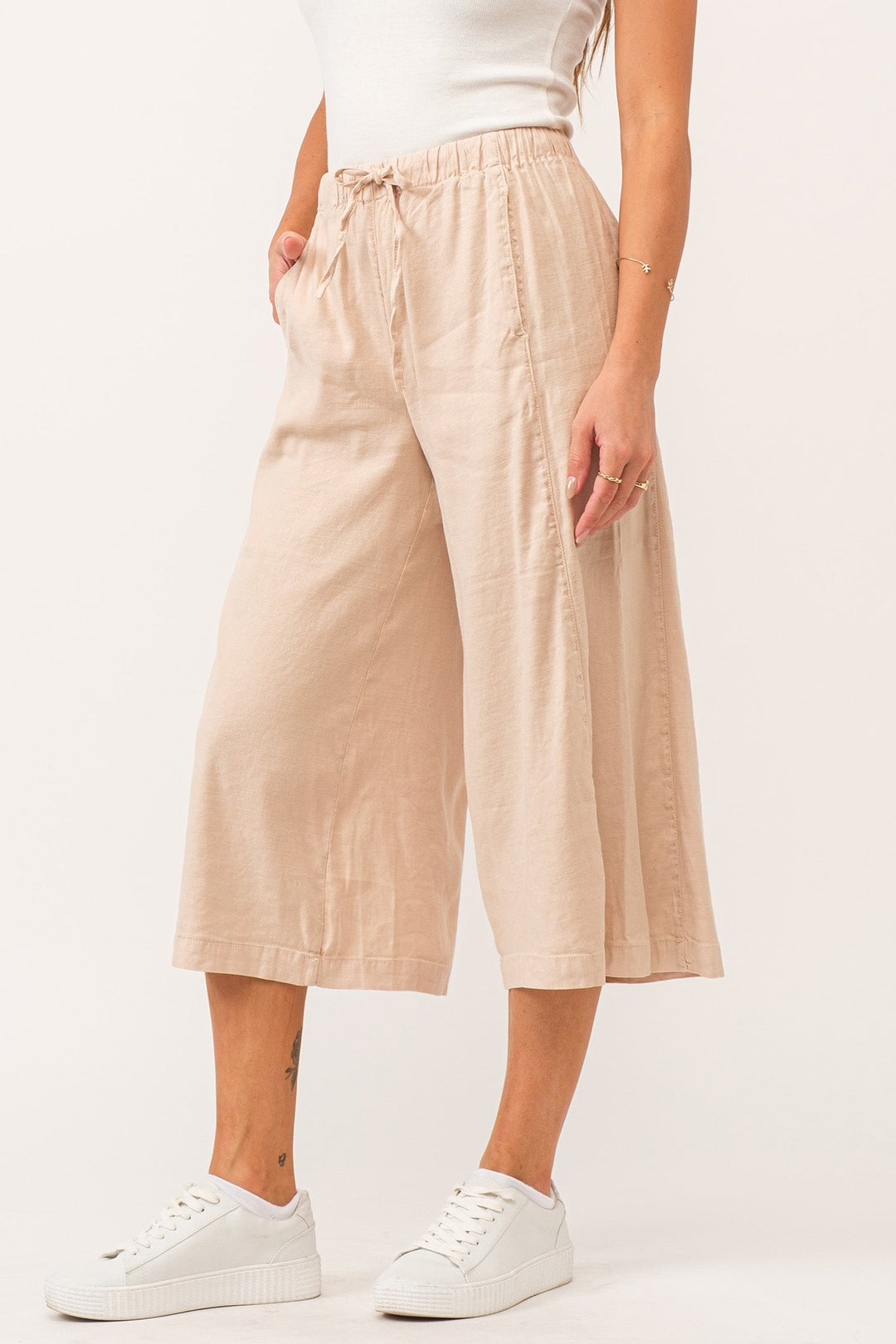 image of a female model wearing a ELINA SUPER HIGH RISE CROPPED WIDE LEG PANTS PEACH FLASH LINEN DEAR JOHN DENIM 