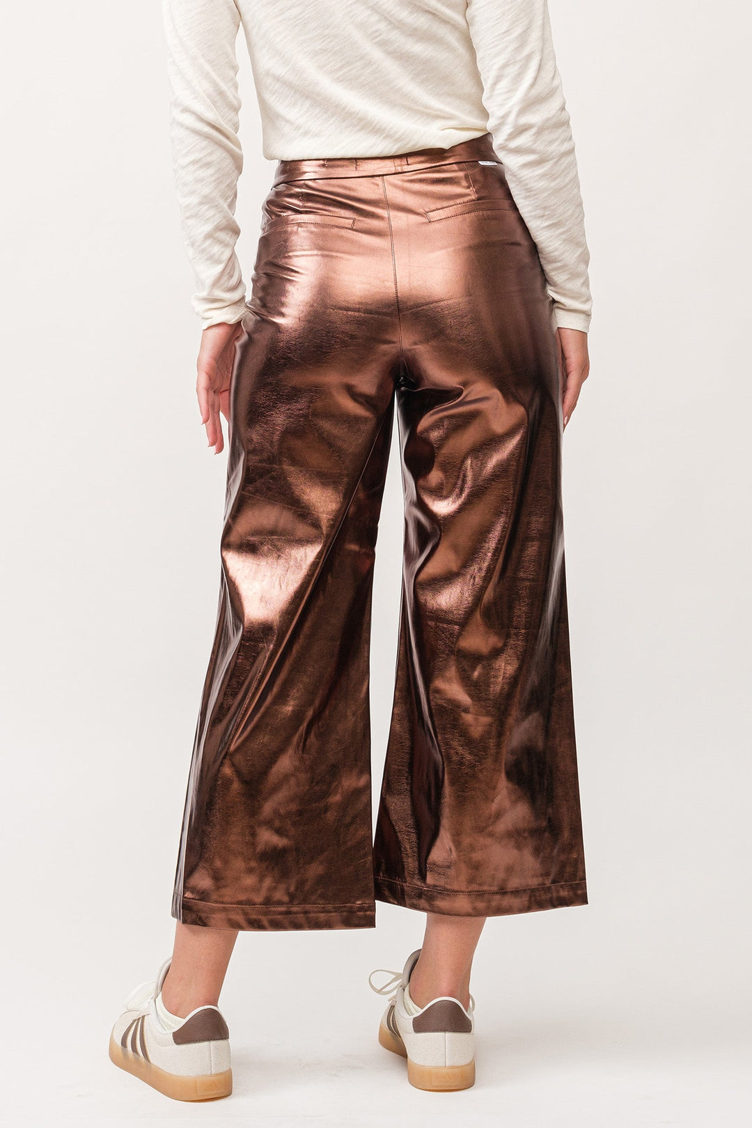 image of a female model wearing a AUDREY HIGH RISE WIDE CLEAN HEM PANTS RUST COPPER FOIL VEGAN LEATHER DEAR JOHN DENIM 