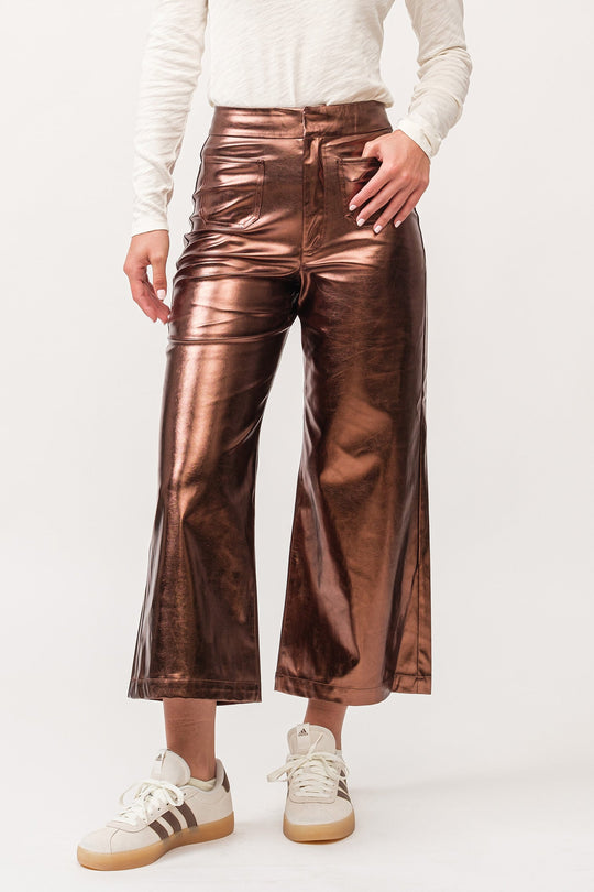 image of a female model wearing a AUDREY HIGH RISE WIDE CLEAN HEM PANTS RUST COPPER FOIL VEGAN LEATHER DEAR JOHN DENIM 