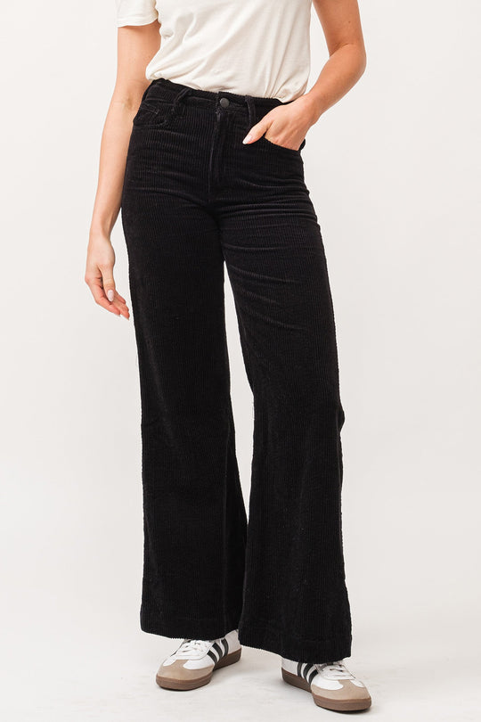 image of a female model wearing a FIONA HIGH RISE CLEAN HEM WIDE LEG PANTS BLACK CORDUROY DEAR JOHN DENIM 