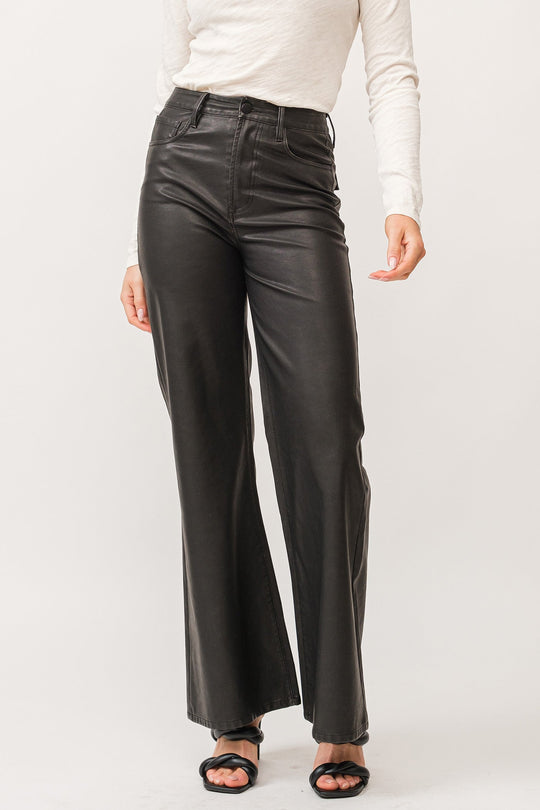 image of a female model wearing a FIONA HIGH RISE CLEAN HEM WIDE LEG PANTS SMOKED CHARCOAL VEGAN LEATHER DEAR JOHN DENIM 