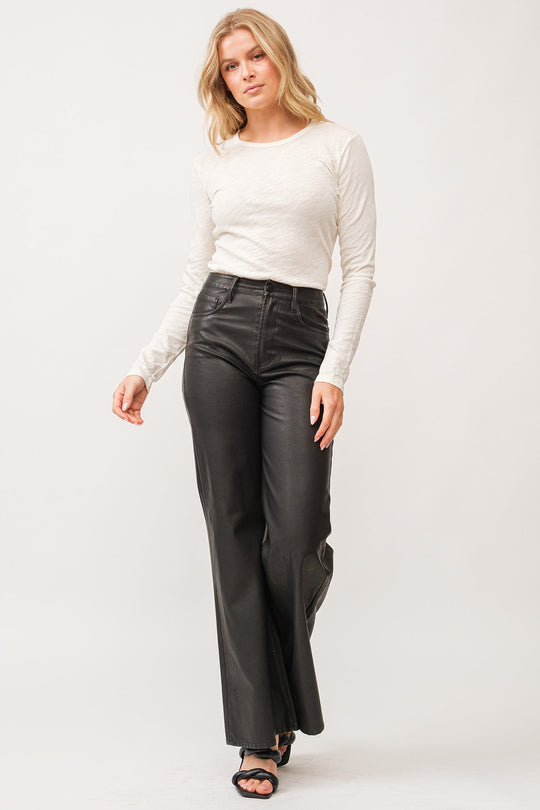 image of a female model wearing a FIONA HIGH RISE CLEAN HEM WIDE LEG PANTS SMOKED CHARCOAL VEGAN LEATHER DEAR JOHN DENIM 