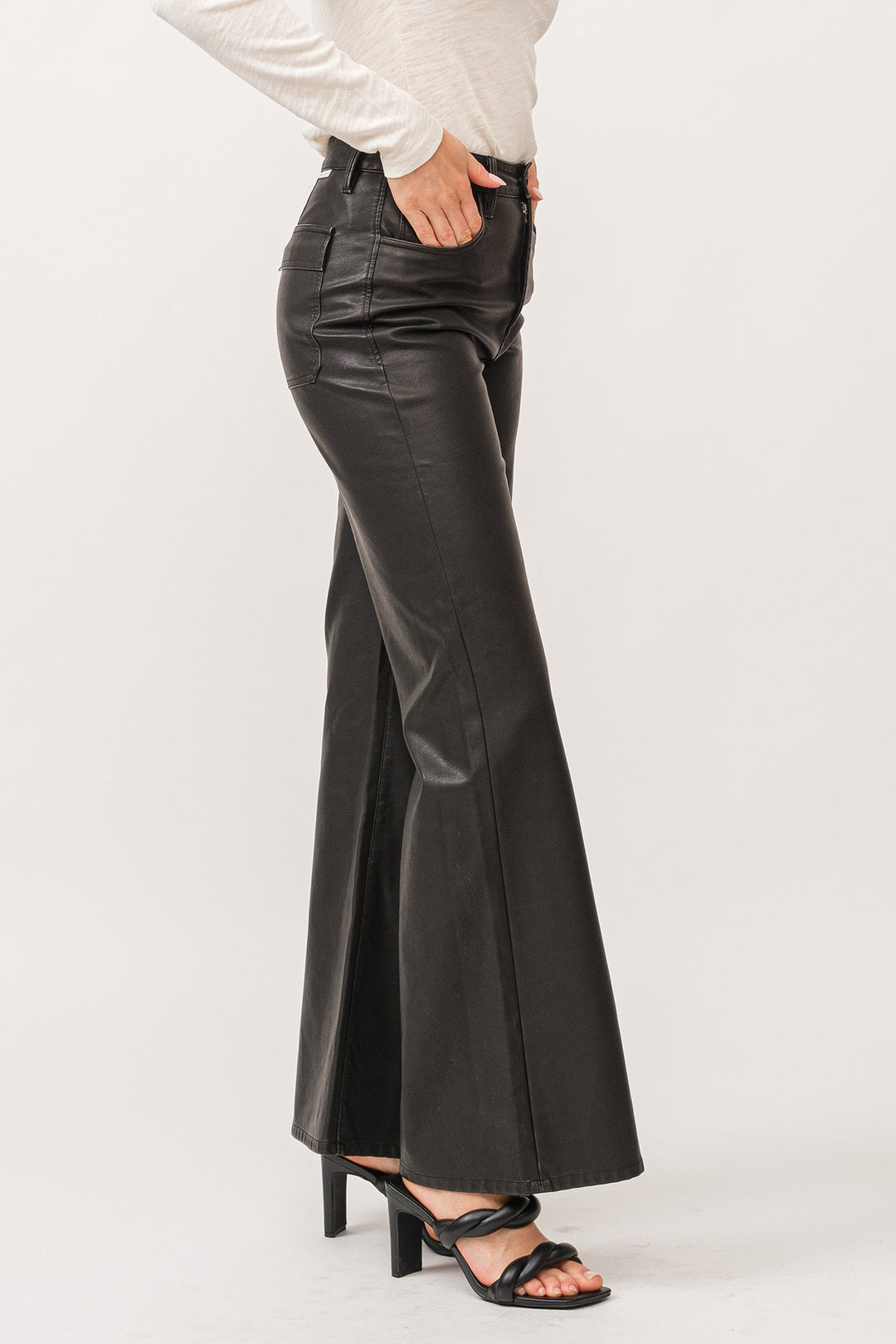 image of a female model wearing a FIONA HIGH RISE CLEAN HEM WIDE LEG PANTS SMOKED CHARCOAL VEGAN LEATHER DEAR JOHN DENIM 