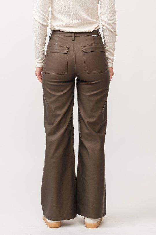 image of a female model wearing a FIONA HIGH RISE CLEAN HEM WIDE LEG PANTS TOASTED COCONUT VEGAN LEATHER DEAR JOHN DENIM 