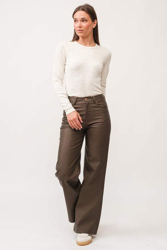 image of a female model wearing a FIONA HIGH RISE CLEAN HEM WIDE LEG PANTS TOASTED COCONUT VEGAN LEATHER DEAR JOHN DENIM 