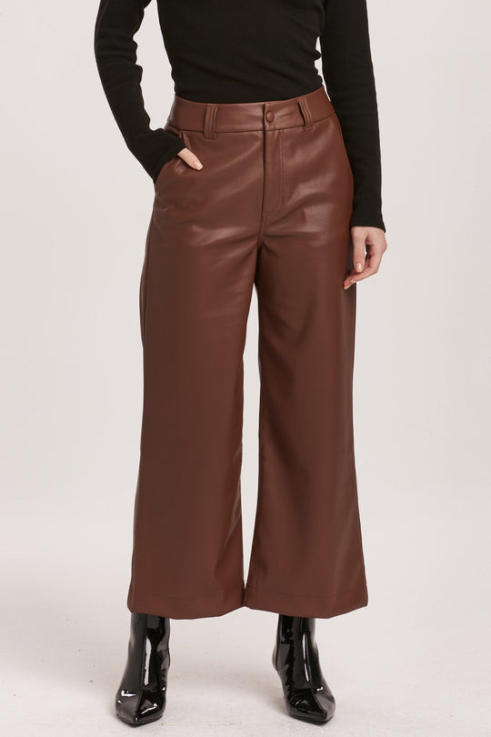 image of a female model wearing a AUDREY SUPER HIGH RISE CROPPED WIDE LEG PANTS MAHOGANY VEGAN LEATHER DEAR JOHN DENIM 