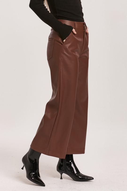 image of a female model wearing a AUDREY SUPER HIGH RISE CROPPED WIDE LEG PANTS MAHOGANY VEGAN LEATHER DEAR JOHN DENIM 