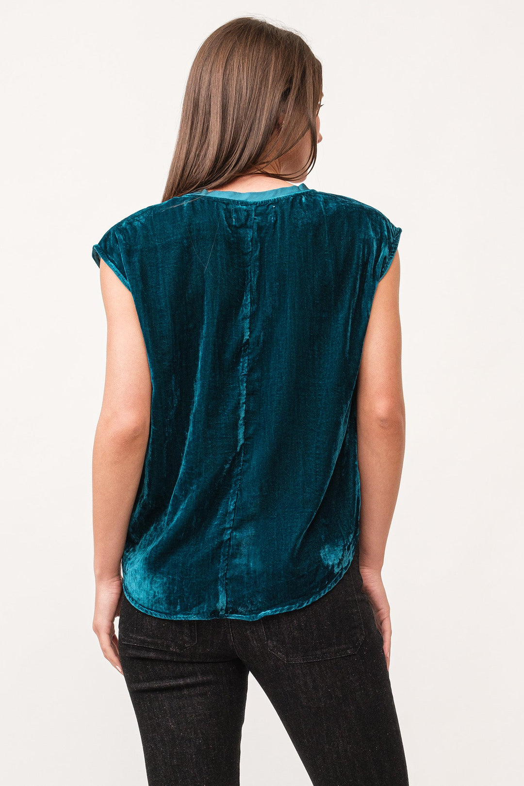 image of a female model wearing a YANIS V-NECK SLEEVELESS VELVET TOP DEEP TEAL DEAR JOHN DENIM 