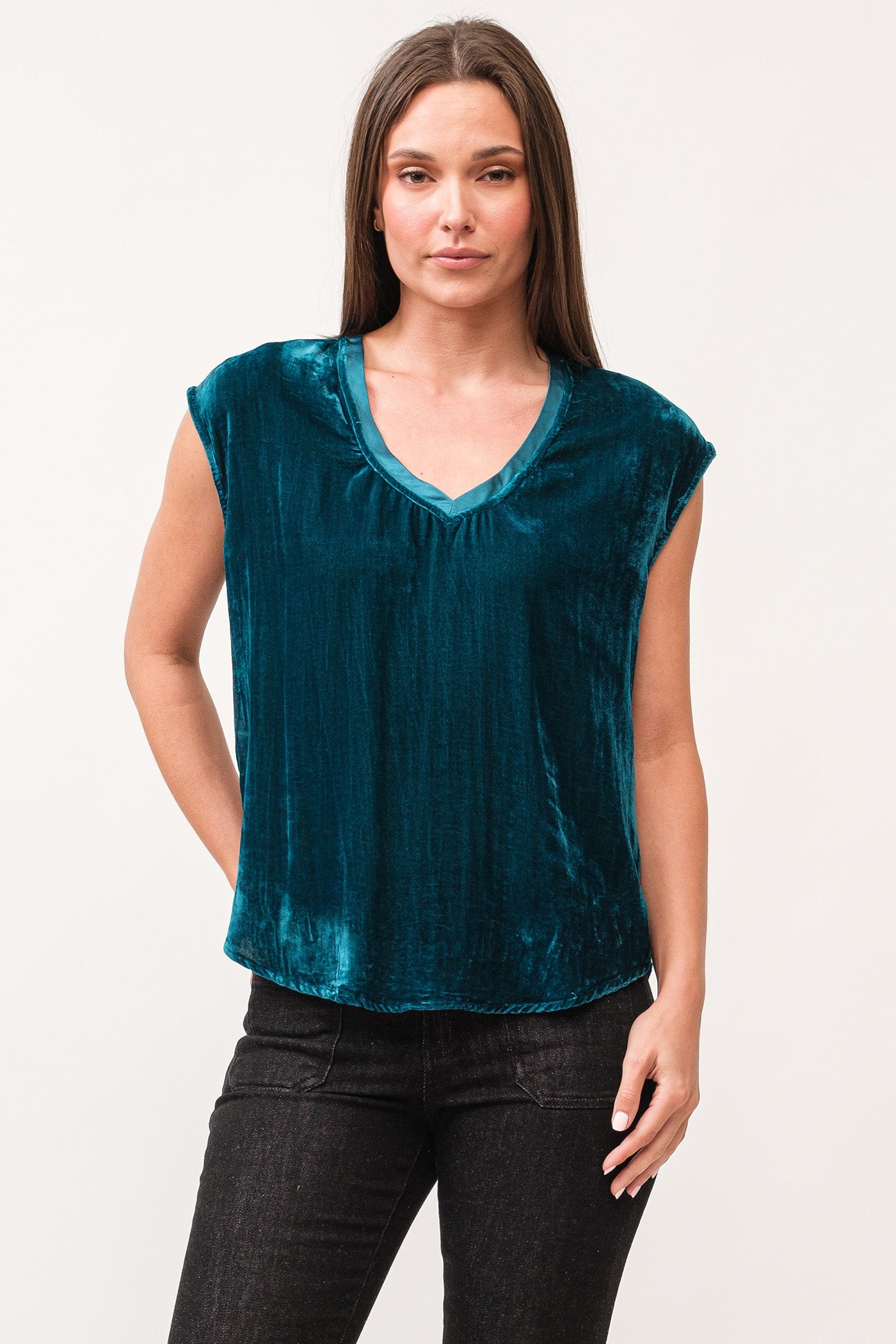 image of a female model wearing a YANIS V-NECK SLEEVELESS VELVET TOP DEEP TEAL DEAR JOHN DENIM 