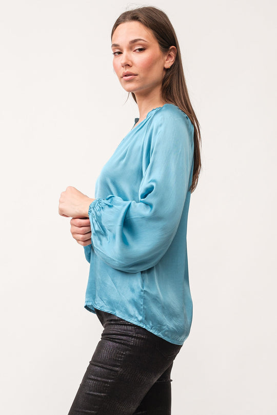 image of a female model wearing a MANON V-NECK LONG SLEEVE TOP BLUE SHADOW DEAR JOHN DENIM 